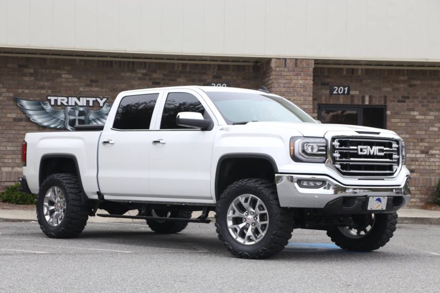 lifted 2016 GMC amp research running boards Trinity Motorsports