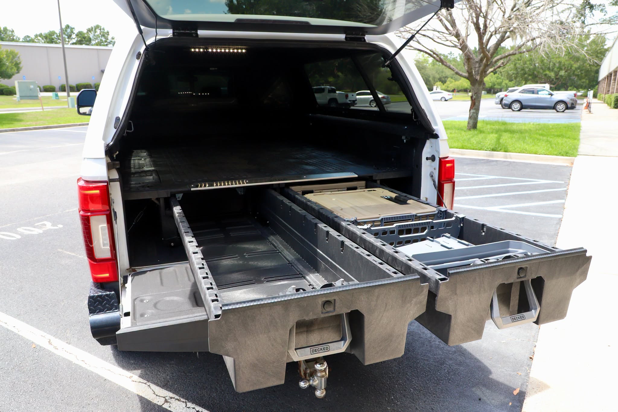 Work Truck with century cap and decked bed accessories at Trinity Motorsports in Pooler GA.